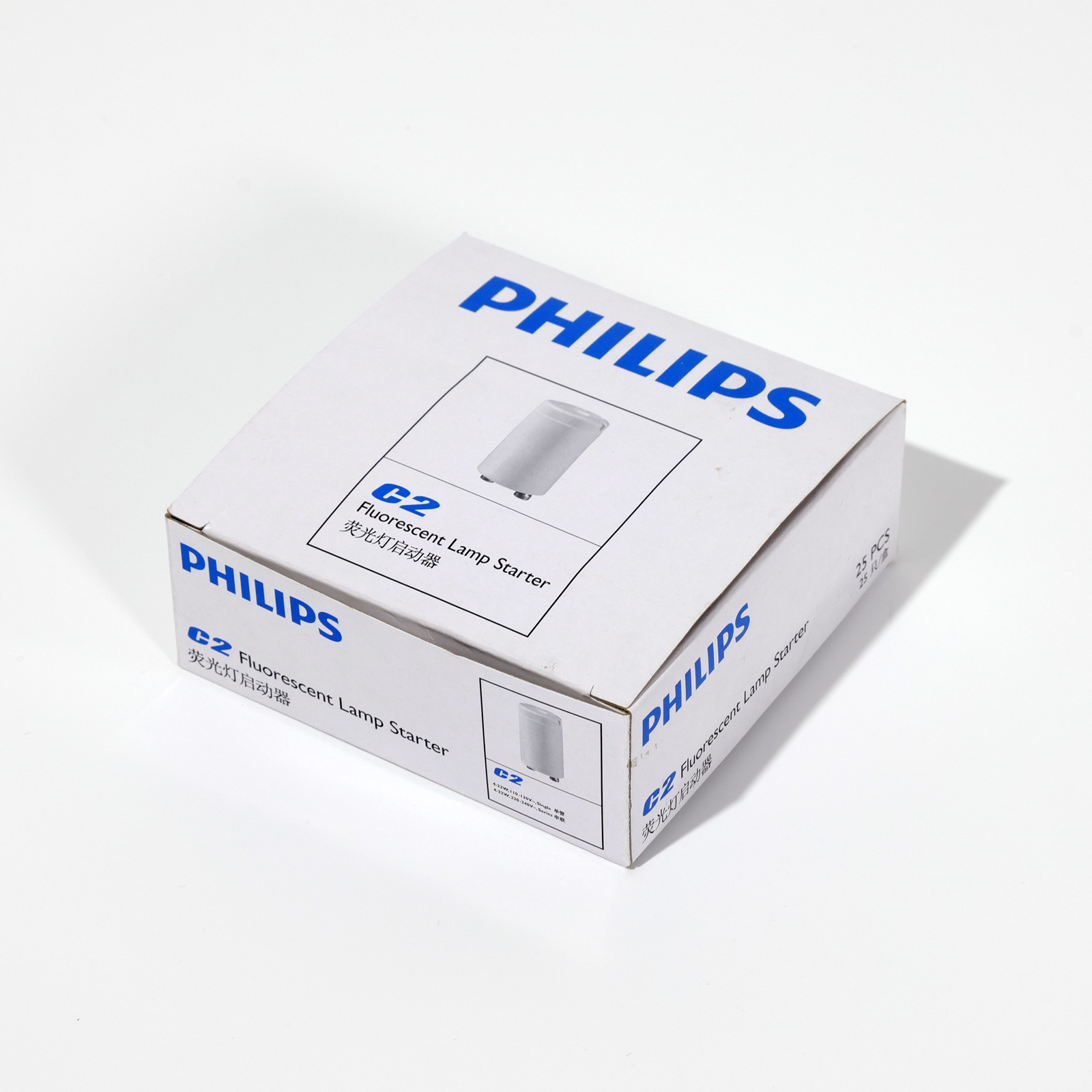 Philips C2 fluorescent lamp starter — two-color folding carton with crash-lock bottom